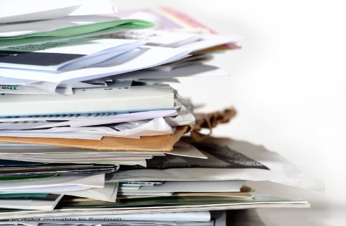 Pile of papers on a white surface